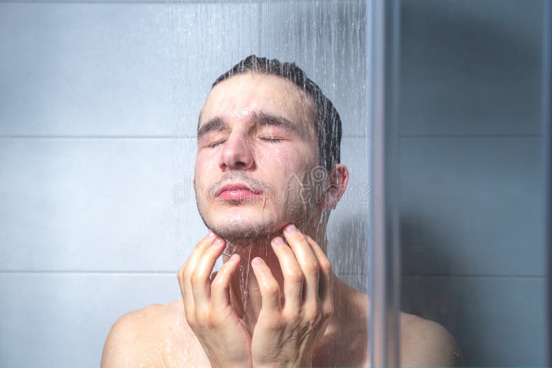 Tired Guy In Shower Under Running Water Relaxes With Closed Eyes Relieves Stress Stock Image