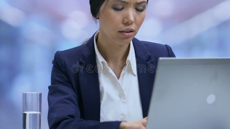 Tired lady office employee suffering strong headache and closing laptop, stress