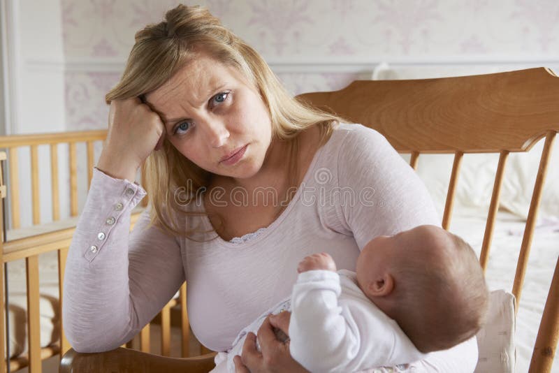 Tired Mother Suffering With Post Natal Depression royalty free stock photography