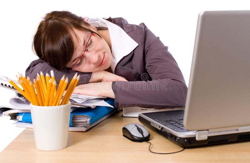 Tired office worker sleeping on her desk, isolated