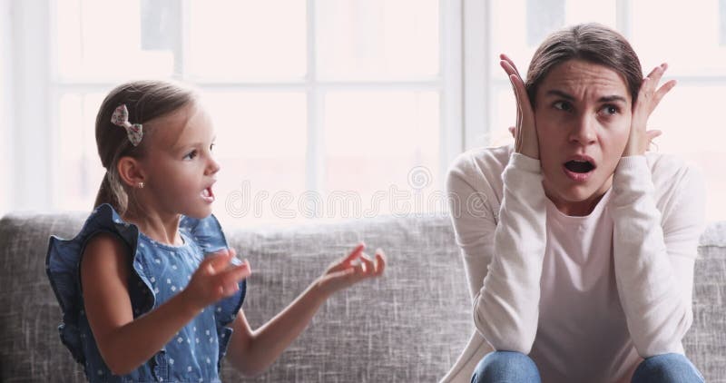 Tired single mother feel desperate about screaming kid daughter