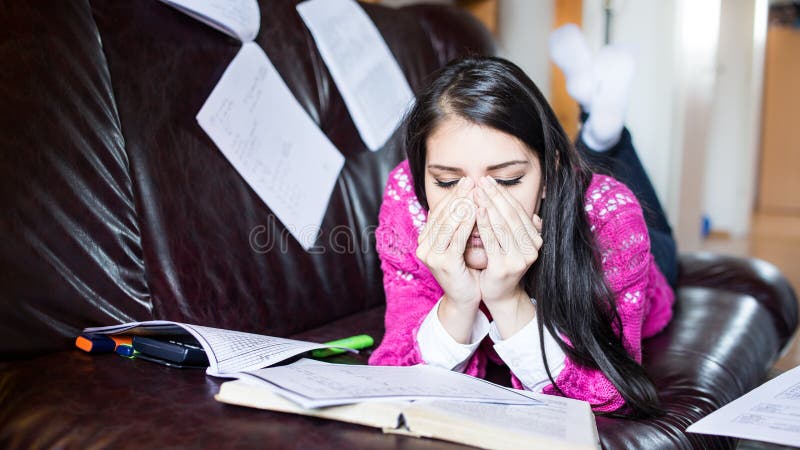 Tired student having a lot to read.Worried stressed student.Student is studying. Study up