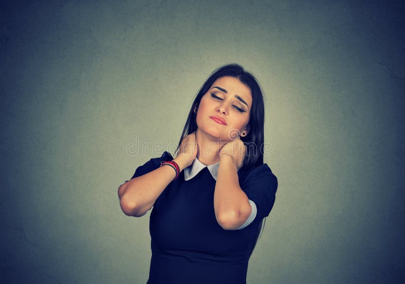 Tired woman massaging strained neck royalty free stock photos Tired woman massaging strained neck royalty free stock photos