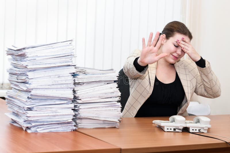 Tired woman in office interior