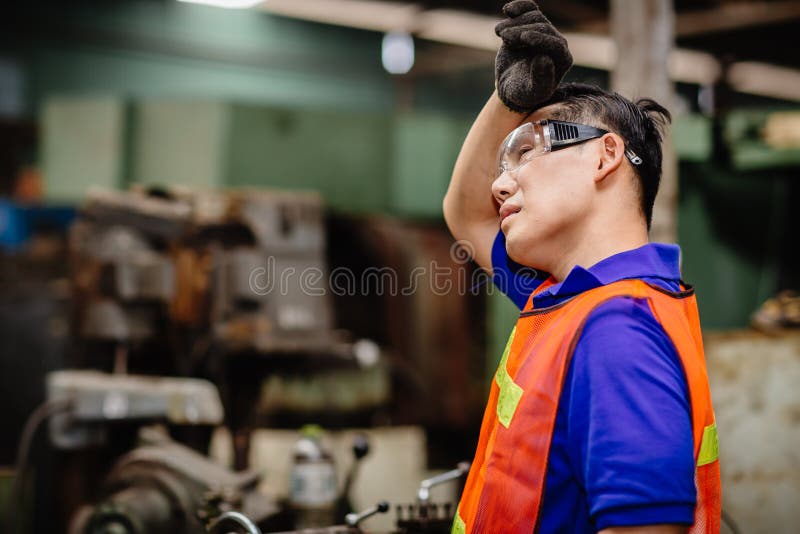 Tired worker, headache hot weather over heat unhealthy engineer working in heavy industry factory