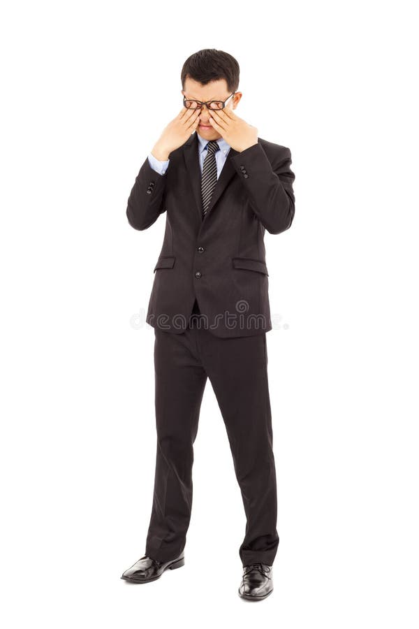 Tired young businessman rubbing his eyes stock images Tired young businessman rubbing his eyes stock images