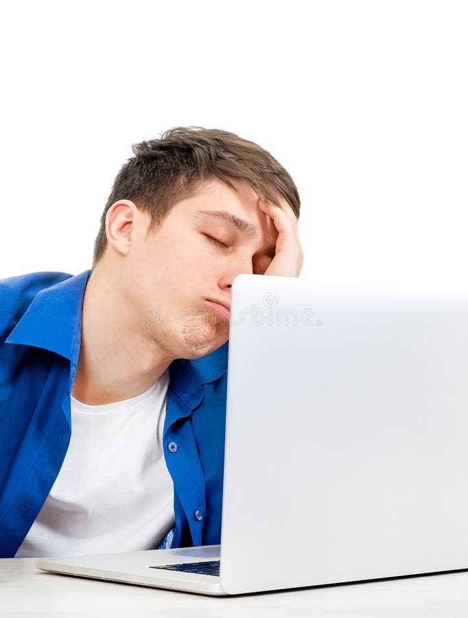 Tired Young Man with a Laptop stock image
