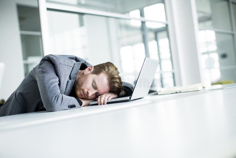 Tired young man sleeping in the office. Tired young man sleeping in the office