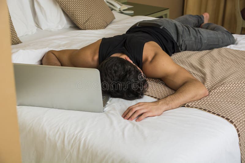 Hairy sleep. Усталый мужчина лежит на животе лица не видно. Man sleeping on Computer.