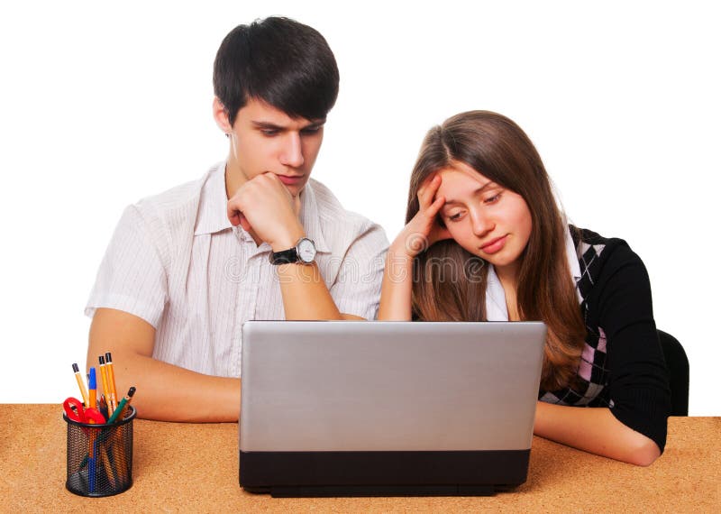 Tired young students studying isolated over white