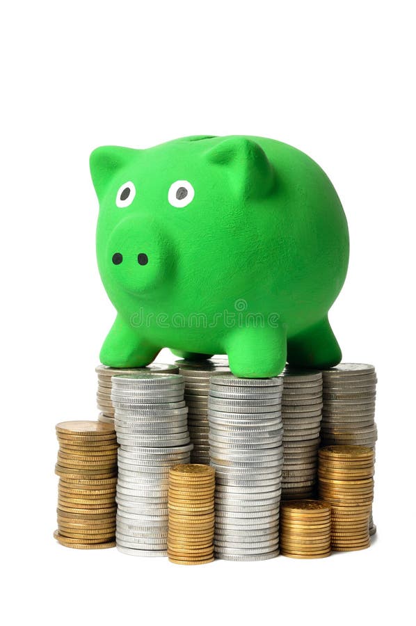 Tirelire et pièces de monnaie vertes images stock