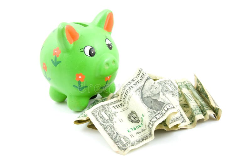 Tirelire verte avec des dollars photographie stock libre de droits