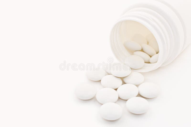 Tiro macro de tabuletas médicas com tubo de ensaio fotografia de stock royalty free Tiro macro de tabuletas médicas com tubo de ensaio fotografia de stock royalty free