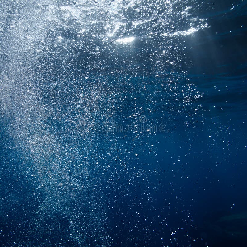 Underwater bubble shot in deep blue tropical sea. Underwater bubble shot in deep blue tropical sea