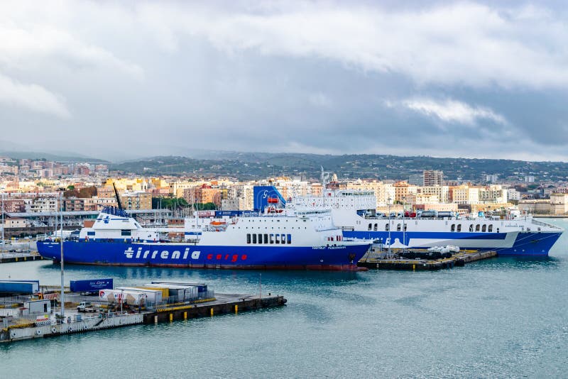 Civitavecchia, Italy - Tirrenia Hartmut Puschmann Ro-Ro Cargo and Passenger Ship and Eurocargo Bari Ro-Ro Cargo Ship Grimaldi Lines at the Port of Civitavecchia, Rome. Civitavecchia, Italy - Tirrenia Hartmut Puschmann Ro-Ro Cargo and Passenger Ship and Eurocargo Bari Ro-Ro Cargo Ship Grimaldi Lines at the Port of Civitavecchia, Rome.