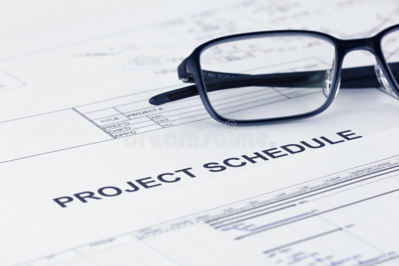 Titel för dokument för projektschema med projektdokument royaltyfria bilder Titel för dokument för projektschema med projektdokument royaltyfria bilder