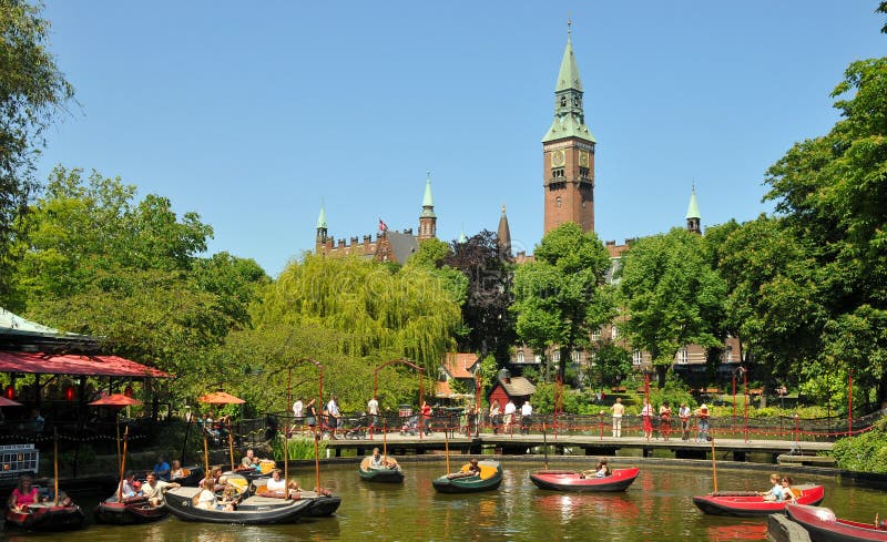 Lake of Tivoli Amusent Park in Copenhagen, Denmark with the Town Hall in the background. Lake of Tivoli Amusent Park in Copenhagen, Denmark with the Town Hall in the background