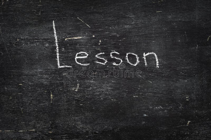Tiza en la pizarra: Lección foto de archivo