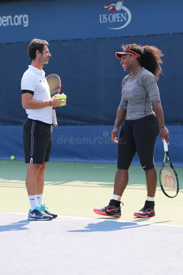 NEW YORK - AUGUST 30, 2015: Twenty one times Grand Slam champion Serena Williams practices for US Open 2015 with her coach Patrick Mouratoglou at National Tennis Center in New York. NEW YORK - AUGUST 30, 2015: Twenty one times Grand Slam champion Serena Williams practices for US Open 2015 with her coach Patrick Mouratoglou at National Tennis Center in New York