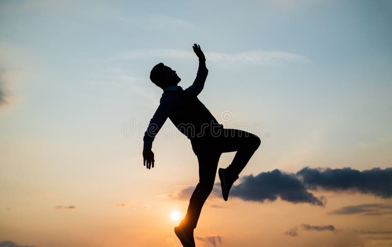 To be free. free man dancing. happiness. need the inspiration. man feel motivation. full of energy. dancer silhouette on