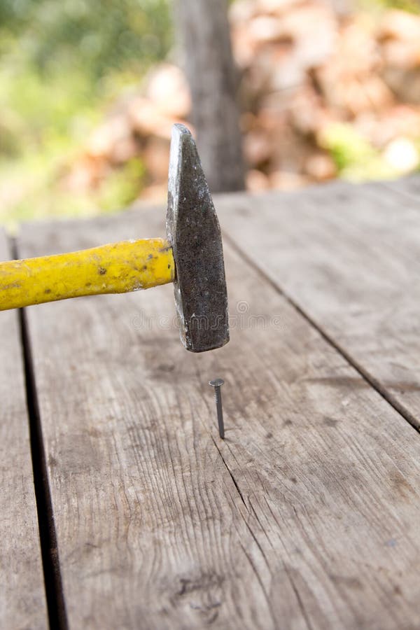 To Hammer A Nail With A Hammer Stock Image - Image Of Carpenter, Items