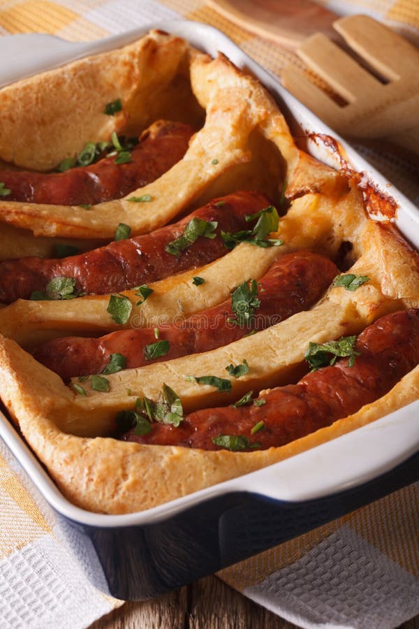 Toad in the Hole in Baking Dish Close Up. Vertical Stock Image Image