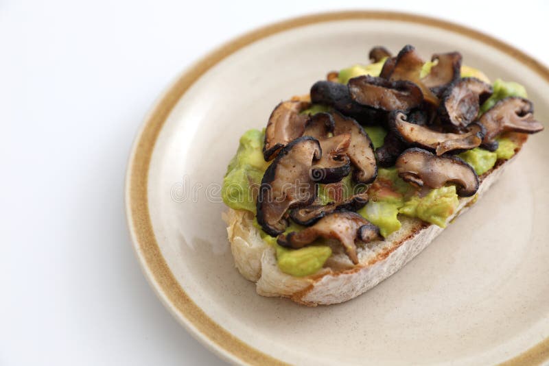 Toast with Avocado and Grilled Mushroom in White Background Stock Image