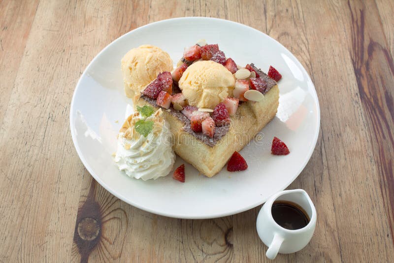 Toast Bread Pudding with Ice Cream and Strawberry Stock Photo Image