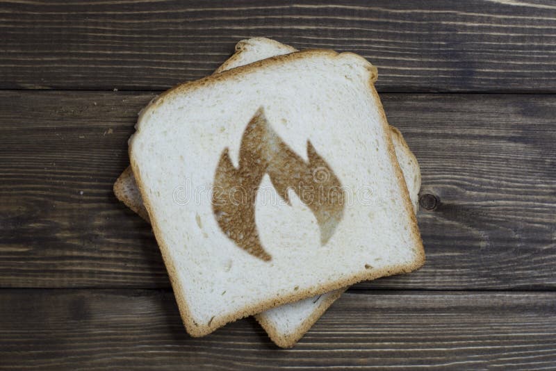 Toast with a Fire Sign on Dark Wood Stock Photo Image of snack