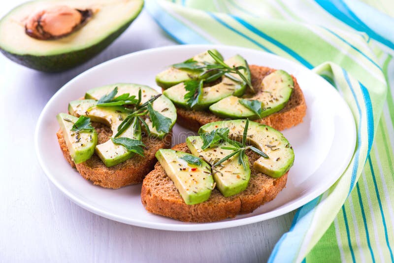 Toast with Rye Bread, Avocado and Herbs on White Plate Stock Image Image of sandwich, brunch