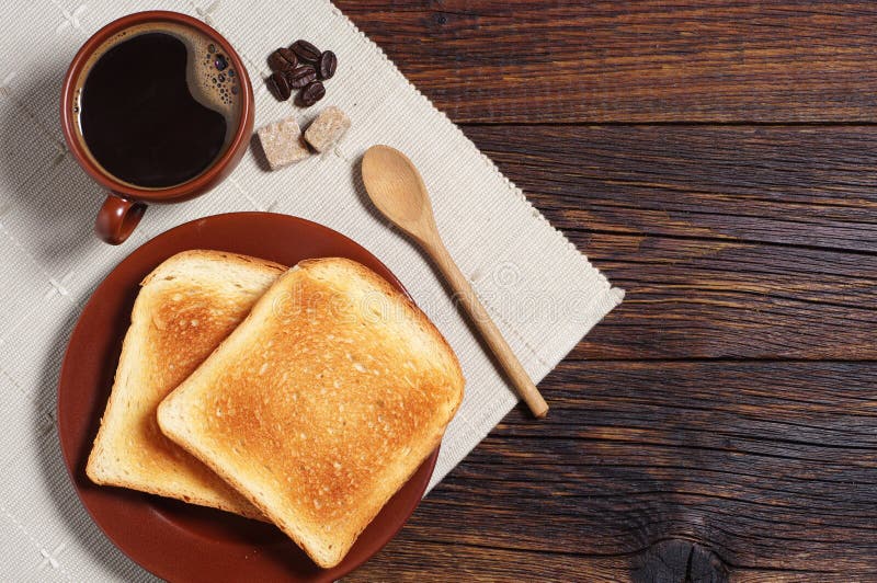 Coffee,slice Of Bread And Coffee Beans On Wooden Table Stock Image