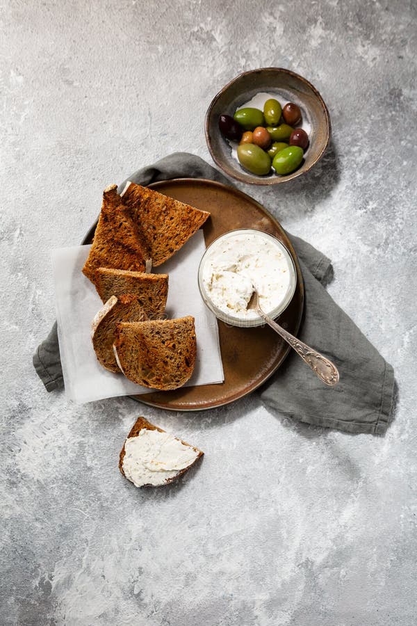 Toasted Bread with Cream Cheese Olive Fruits for Breakfast Top View