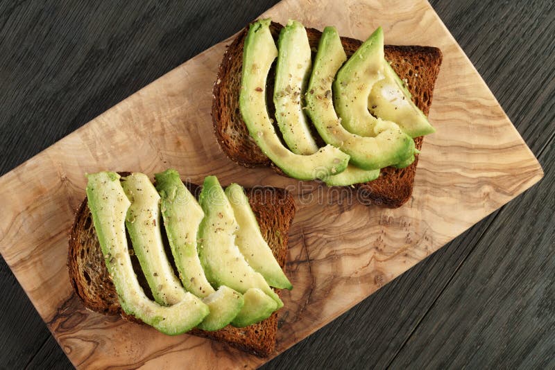 Toasted Rye Bread with Sliced Avocado and Herbs Stock Photo Image of