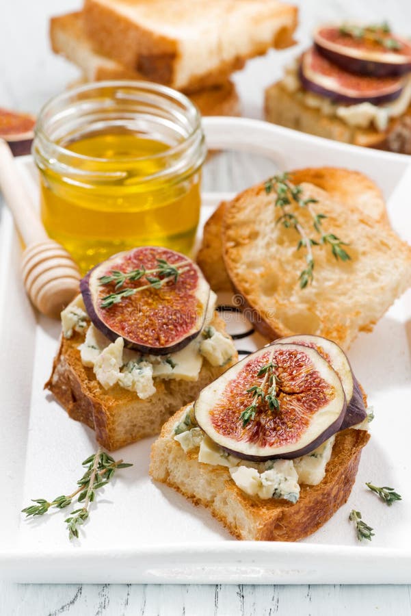 Toasts with Figs, Honey and Blue Cheese, Vertical Stock Photo Image