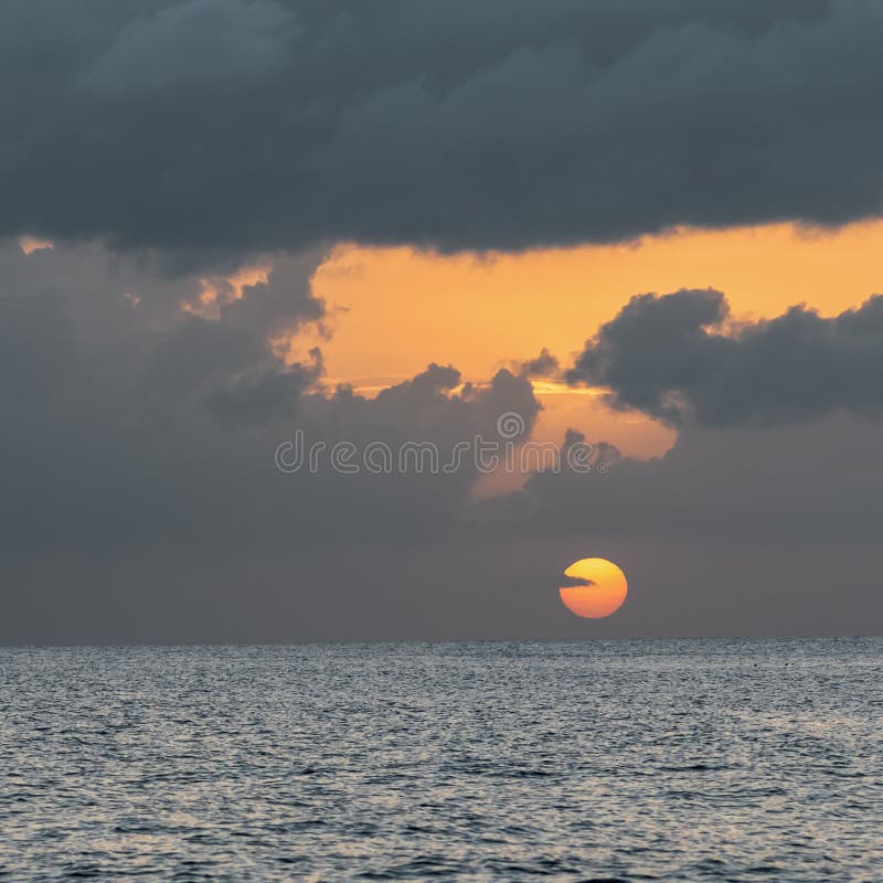 Tobago sunset square composition dusk time cloudy sky tropical