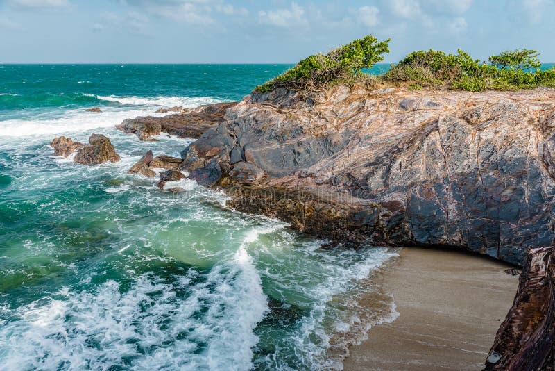 Toco Trinidad and Tobago West Indies rough sea beach cliff edge panorama.