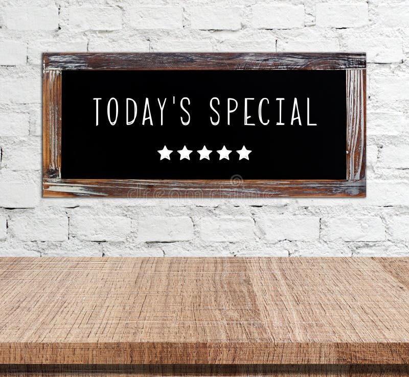 Today's special on vintage chalk board over cement wall and empt stock images