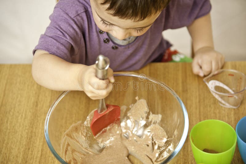 Toddler baking stock image. Image of mixes, eyes, light - 20142685