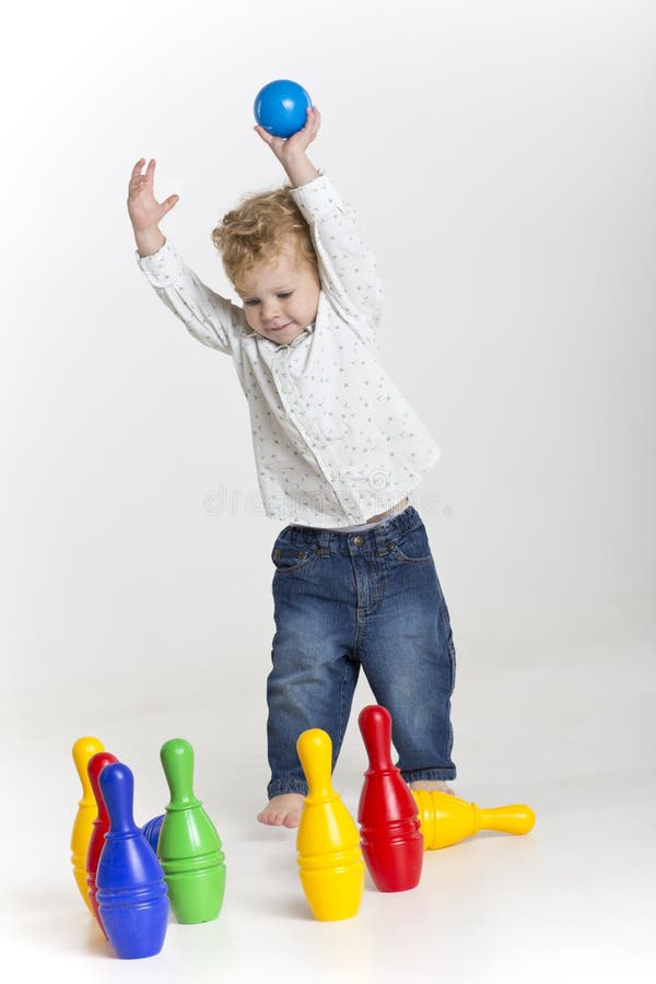 Toddler is bowling