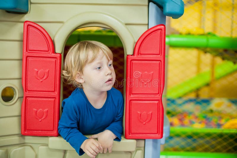Toddler boy looks out of the house royalty free stock photos Toddler boy looks out of the house royalty free stock photos
