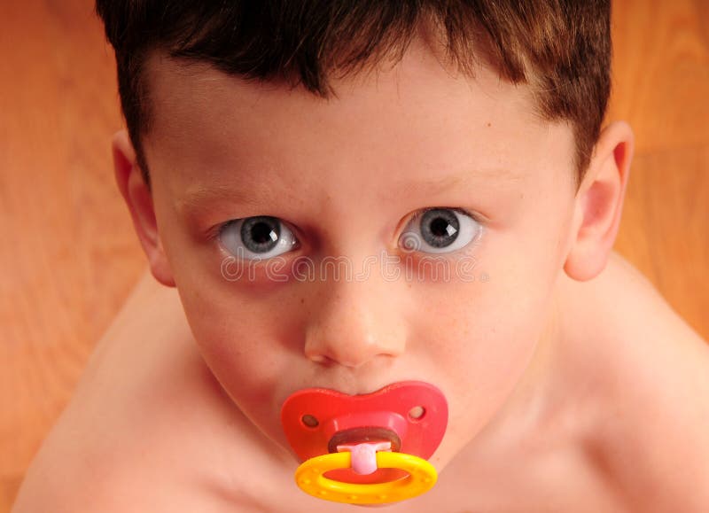Toddler boy with pacifier stock image. Image of expression - 7483855