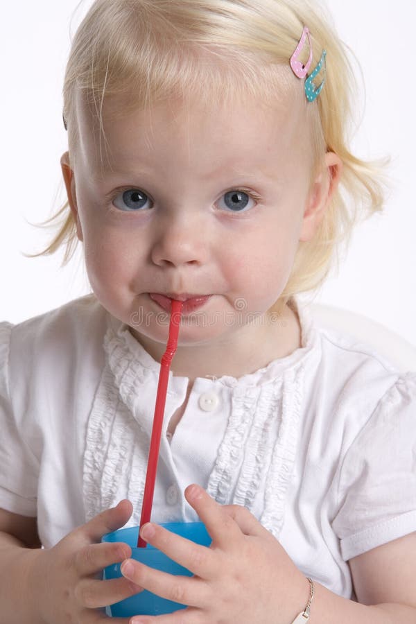 Toddler Drinking with a Straw Stock Photo Image of expression, studio 15369390