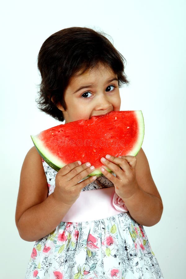 Toddler eating watermelon