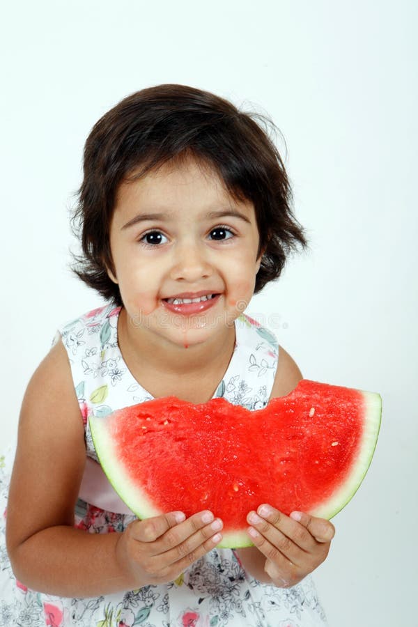 Toddler eating watermelon