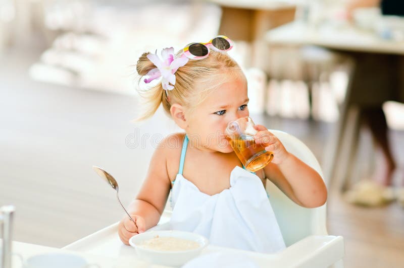 Toddler girl have a breakfast