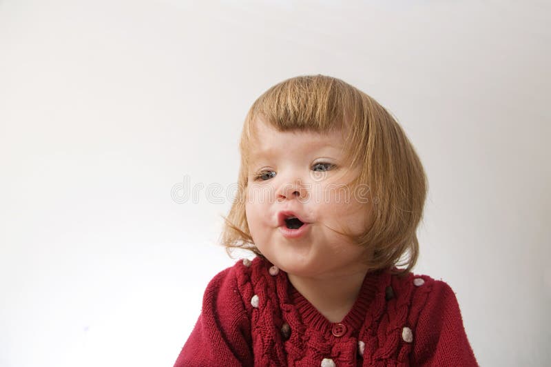 Toddler girl playing emotionally royalty free stock photography Toddler girl playing emotionally royalty free stock photography