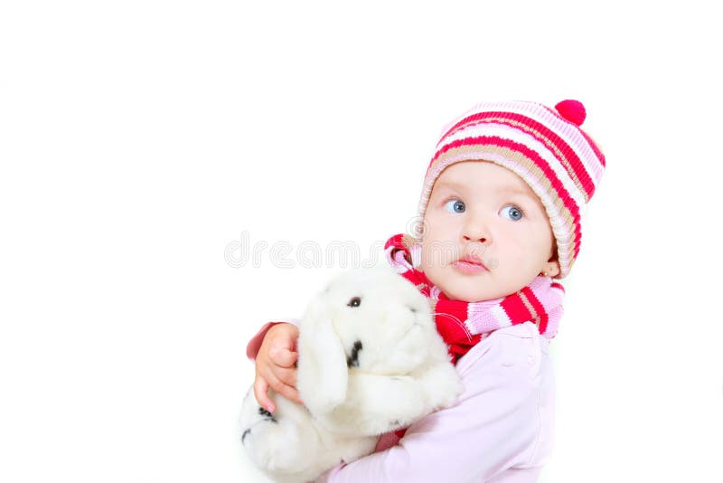 Toddler girl with toy rabbit