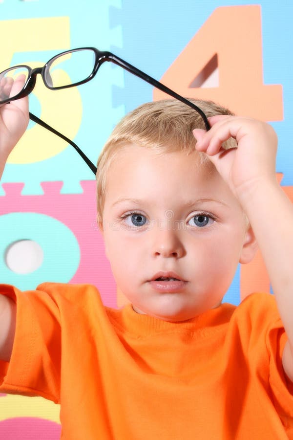 Toddler with glasses stock photo. Image of blue, spectacles 6432856