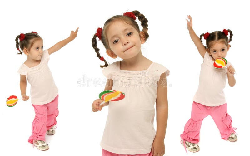 Toddler holding a lollipop wit