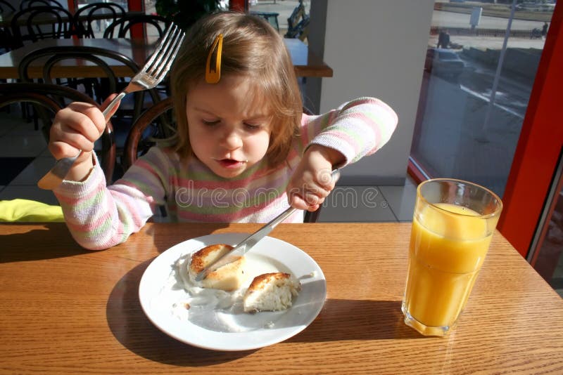 Toddler with knife and fork